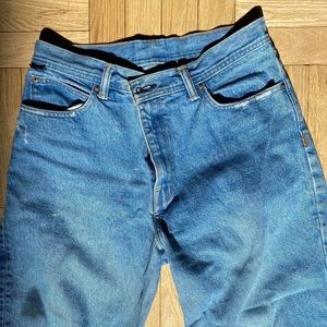 Medium wash BDG mid rise mom jeans.